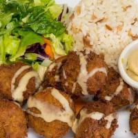 Falafel Dinner · Eight pieces. Chickpeas, parsley, onion, and garlic mashed and lightly fried. Served with ri...