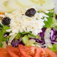 Mediterranean Salad · Fresh lettuce, red cabbage, carrots, tomatoes and cucumber topped with feta cheese and dress...