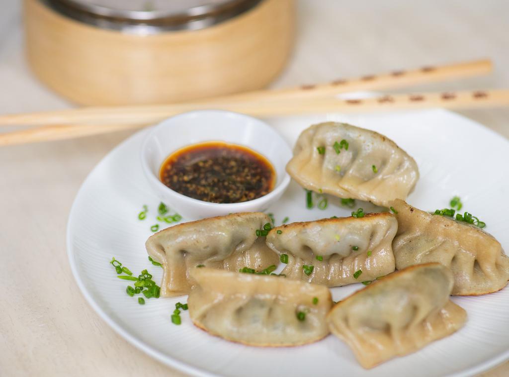 Vegetable Dumplings  · Housemade spinach & shiitake dumplings. Served with soy, ginger, and sesame sauce.

6 pcs