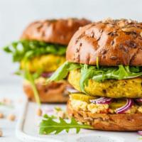 The Vegan Burger · Fresh vegan patty, lettuce, tomatoes, and ketchup on a fresh-baked bun.