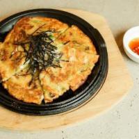 Pajeon · Traditional scallion pancake with kimchi.