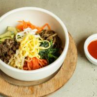 Bibim Bap · Most popular. Sautéed and seasoned vegetables over rice served with beef and fried egg.
