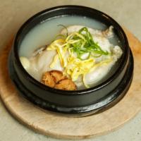 Samgae Tang · Ginseng chicken soup. Whole cornish hen stuffed with ginseng, chestnuts, garlic, and sweet r...