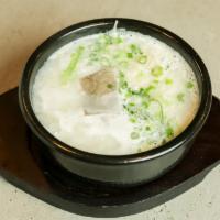 Seollong Tang · White ox-bone soup with beef brisket, scallions and rice starch noodles. Serve with white rice