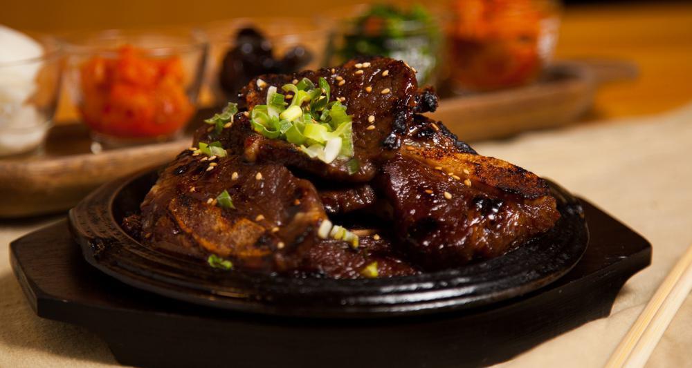 Kalbi · Marinated and seasoned beef short ribs. Serve with rice