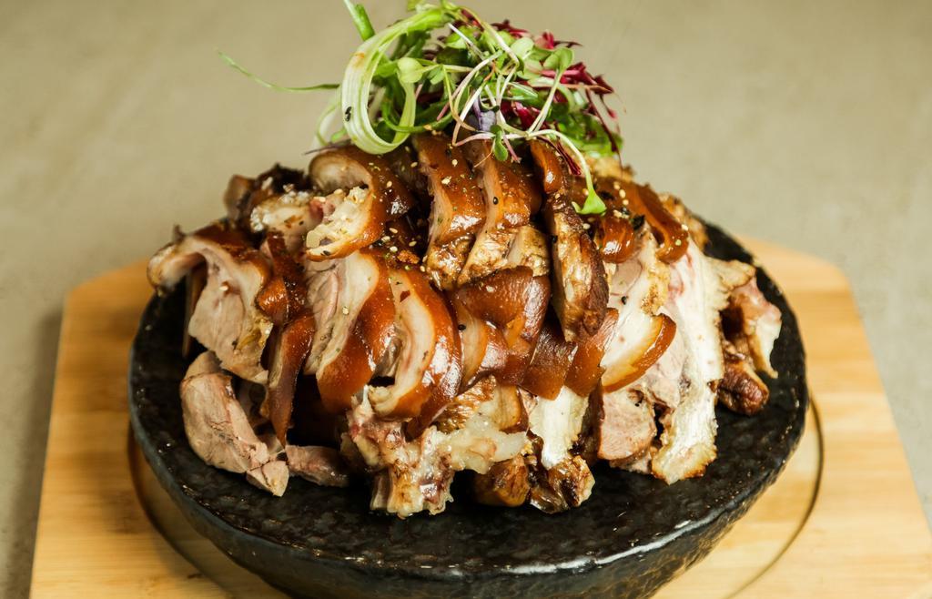 Jokbal · Pig's trotters cooked with soy sauce and spices. Comes with lettuce and Korean sauce and serve with 2 rices