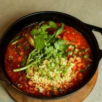 Budae Stew · Spicy. Kimchi stew with sausage, pork, ramyun, and vegetables. serve with 2 rices