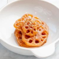 Braised Lotus Roots · 8 oz. Round slices of lotus root simmered in sweet soy sauce and rice wine.