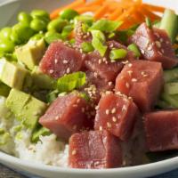Sushi Salad · Fresh raw salmon and tuna on a bed of fresh lettuce, cucumber, carrots and creamy avocado sl...