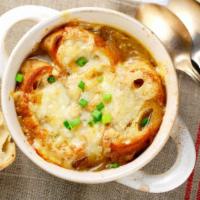 French Onion Soup · Rich, caramelized onion broth with melted cheese and croutons.
