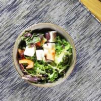 Greek Salad · Romaine lettuce, feta, tomato, olives, cucumbers and onions.
