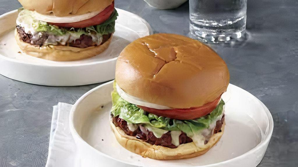 Classic Burger · With lettuce, tomato, raw onions and ketchup.