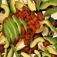 Avocado Salad · Baby arugula with fresh mozzarella, avocado, roasted peppers, tomato and green olives.