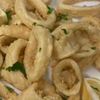 Fried Calamari · Crispy fried calamari comes with lemon and fresh marinara sauce!
