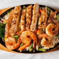 Combination Fajita · Choice of any two beef, chicken, or shrimp over grilled onions and peppers served on a sizzl...