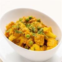 Aloo Gobi Matar · Lightly spiced potatoes, cauliflower, green peas, ginger-tomato sauce.