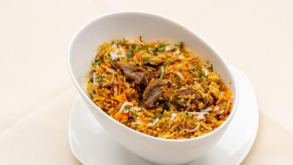 Goat Biryani · Baby goat meat, basmati rice cooked in a sealed pot with aromatic spices.