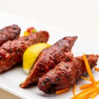 Sheekh Kabab · Ground lamb, fresh herbs, spices.