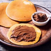 Nutella Pancakes · Light, airy, fluffy pancakes with a generous smear of chocolate Nutella.