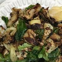 Crispy Artichoke Salad · With arugula, white beans, and Parmesan.
