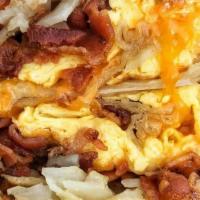 Tj'S Breakfast Burrito · Scrambled eggs, bacon, American cheese, seasoned potatoes, our ketchup mayo sauce wrapped in...