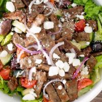 Mediterranean Salad · Romaine, kalamata olives, cucumbers, tomatoes, red onions and feta served with our Zesty dre...