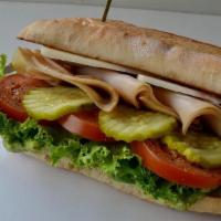 Bodega Sandwich · Smoked turkey, sharp provolone, red pepper jam, red onion & sliced tomato