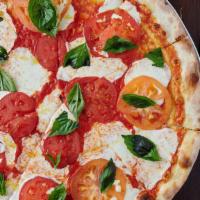 Margherita · It comes with Fresh Mozzarella cheese, tomato slices and fresh basil