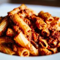 Rigatoni Bolognese · Rigatoni pasta sautéed in a hearty meat sauce with parmesan.