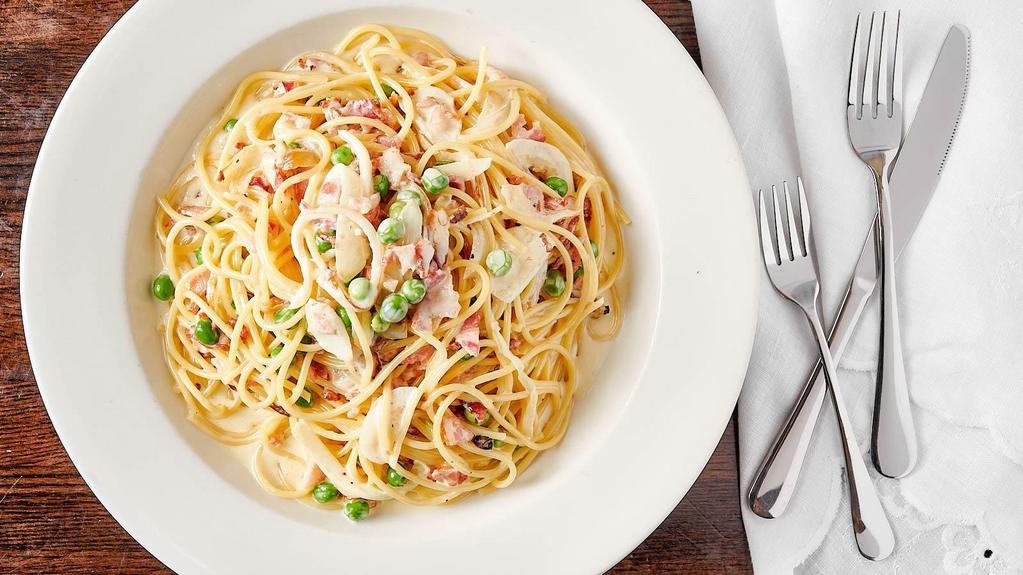 Spaghetti Carbonara · Spaghetti pasta with sautéed peas, onions, bacon and egg yolk.