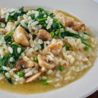Chicken Risotto · Arborio rice with shiitake mushrooms, peas, spinach and chicken.