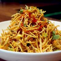 Chinese Bhel · Crispy noodles tossed with cilantro, fresh lime juice, sweet and sour sauce.