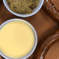 Giant Bavarian Pretzel · Cheese sauce, spicy beer-infused mustard.