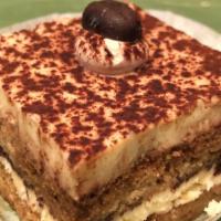 Tiramisu · Vanilla Cake soaked with Coffee. With Mascarpone & Cream Cheese. Topped with Cocoa