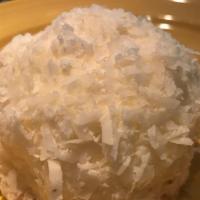 Coconut Snowball  · Vanilla Sponge Cake Topped With a Mound of Creamy 
Coconut Mousse. Covered With Coconut Flak...