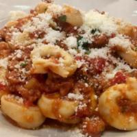 Tortellini Bolognese · Tortellini pasta stuffed with cheese served in our homemade meat sauce.