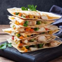 Chicken Fajita Quesadilla · Grilled chicken, cheddar cheese, roasted peppers, caramelized onions and salsa.