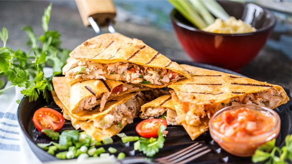Chicken And Bacon Quesadilla · Grilled marinated chicken and crispy bacon with cheddar and Jack cheese, salsa and sour cream.