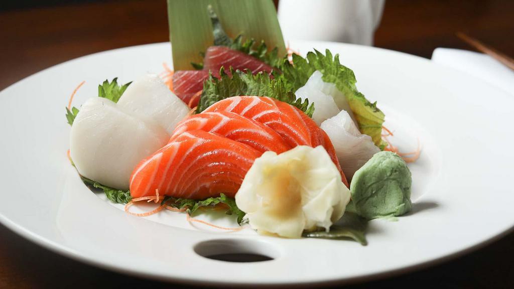 Regular Sashimi Entree · Twelve pieces of assorted fish. Served with a salad or miso soup.