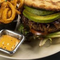 Vegan Burger · Plant Based Pattie, Avocado, Caramelized Onions, Fresh Lettuce and Fresh Tomatoes.