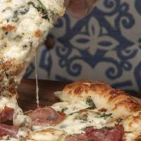 Truffle Delight · Creamy Spinach, Mozzarella, Brie Cheese, Mushroom, Prosciutto and Truffle Oil.