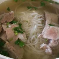 Pho Bo Soup · A hearty ox tail soup with rice noodles, thinly sliced beef and beef shank, top with chopped...