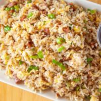 Susan'S Famous Fried Rice · Fried rice with Chinese sausage, egg, and scallion in roasted minced garlic.