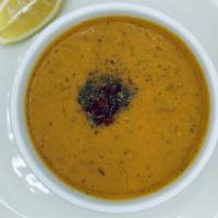 Red Lentil Soup · Red lentils, onions, spices.