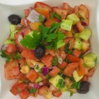 Shepherd Salad · Finely chopped tomatoes, cucumbers, onion and parsley tossed with vinegar and olive oil dres...
