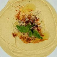 Hummus · Contains nuts. Chickpea spread flavored with garlic, tahini, lemon & olive oil.