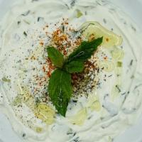 Cacik · Fresh yogurt with finely chopped cucumbers, garlic, dried mint.