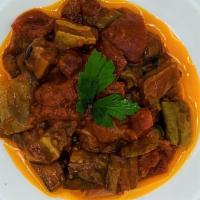 Eggplant With Tomato Sauce · Cubes of pan-fried eggplant, sautéed with tomatoes, peppers and garlic.