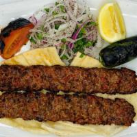 Adana Kebab · Char-grilled ground lamb seasoned with mixed spices served with rice/bulgur (cracked-wheat) ...