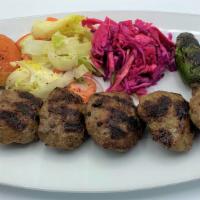 Kofte Kebab · Char-grilled ground lamb and beef meatballs seasoned with Mediterranean spices.